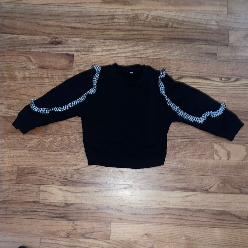 Black checkered ruffle sweatshirt approx size 3-4